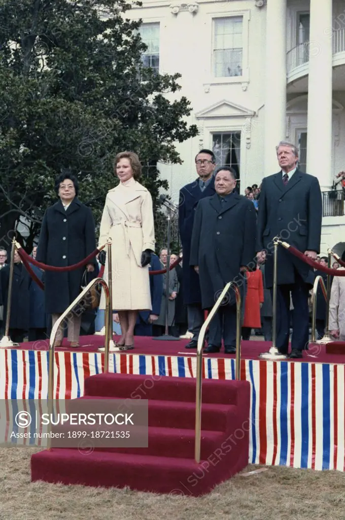 Madame Zhuo Lin, Rosalynn Carter, Deng Xiaoping and Jimmy Carter at the arrival ceremony for the Vice Premier of China. circa  29 January 1979.