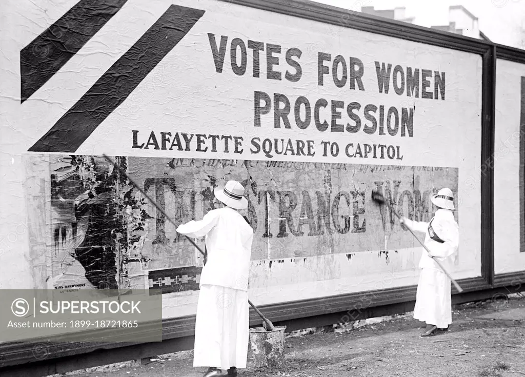 Woman suffragettes working on billboard circa 1914.