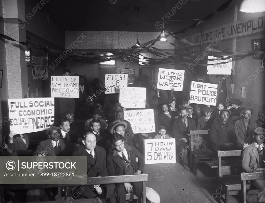 Labor protesters with signs: 'Full Social and Economic Equality for Negros,' 'Unity of White-and-Negro Workers,' etc. circa 1930.