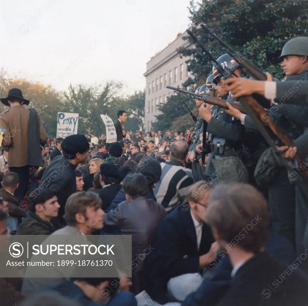 Members of the Military Police keep back Vietnam War protesters during their sit-in at the Mall Entrance to the Pentagon. This was the first major protest against the war, Washington, DC, 10/21/1967. GG Vintage Images