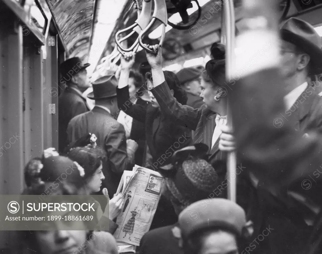 This view of a crowded New York subway car shows the best most commuters can hope for during rush hours is a strap to hang on to, New York, NY, 1948. (Photo by United States Information Agency/GG Vintage Images) 