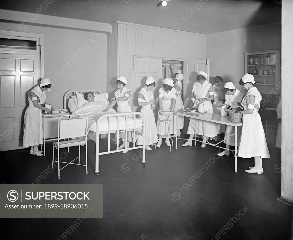 Nurse taking the pulse of a patient at the Homeopathic Hospital, Washington, D.C. ca.  between 1910 and 1926.