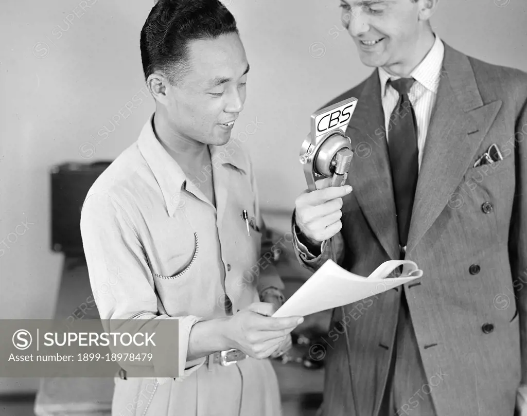 Key Nishimura with announcer Chet Huntley of CBS in a nationwide broadcast at this War Relocation Authority center for evacuees of Japanese ancestry 5/26/1942. 