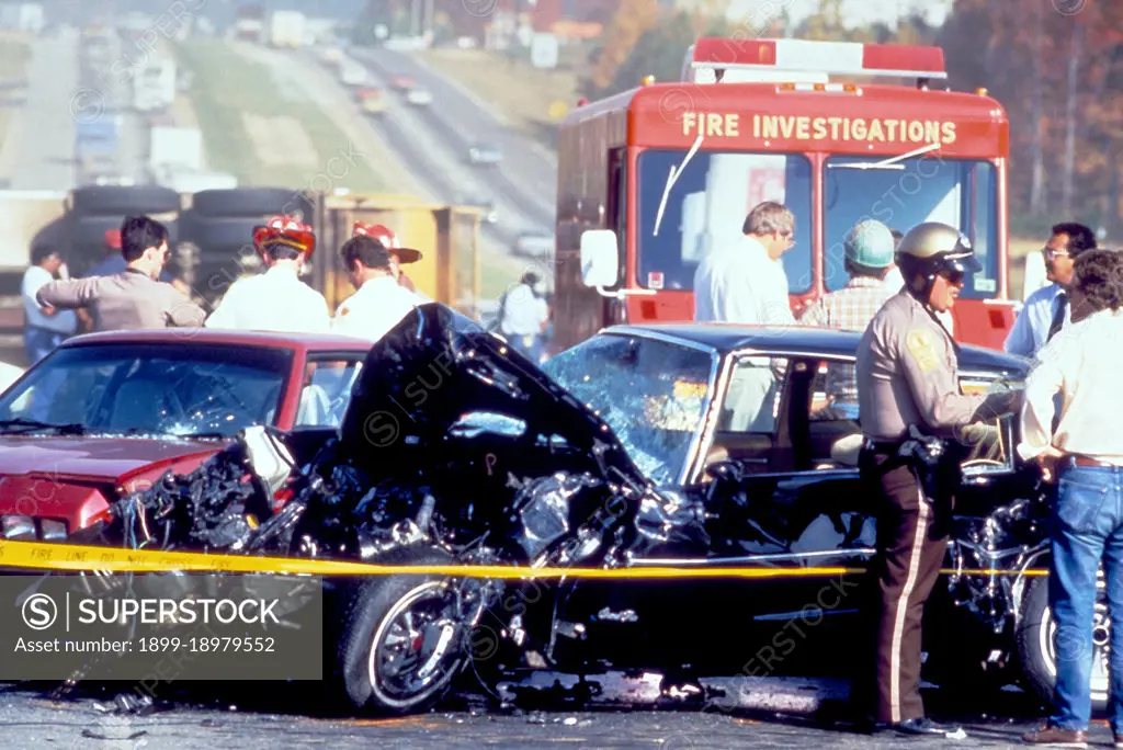 This photograph, captured in metropolitan Atlanta, Georgia, depicts what had been a severe motor vehicle collision. At this point, Atlanta police, paramedics, and the Fire Investigation Team, were all on the scene. The drivers conditions were not known, nor the details surrounding the cause of this accident. 