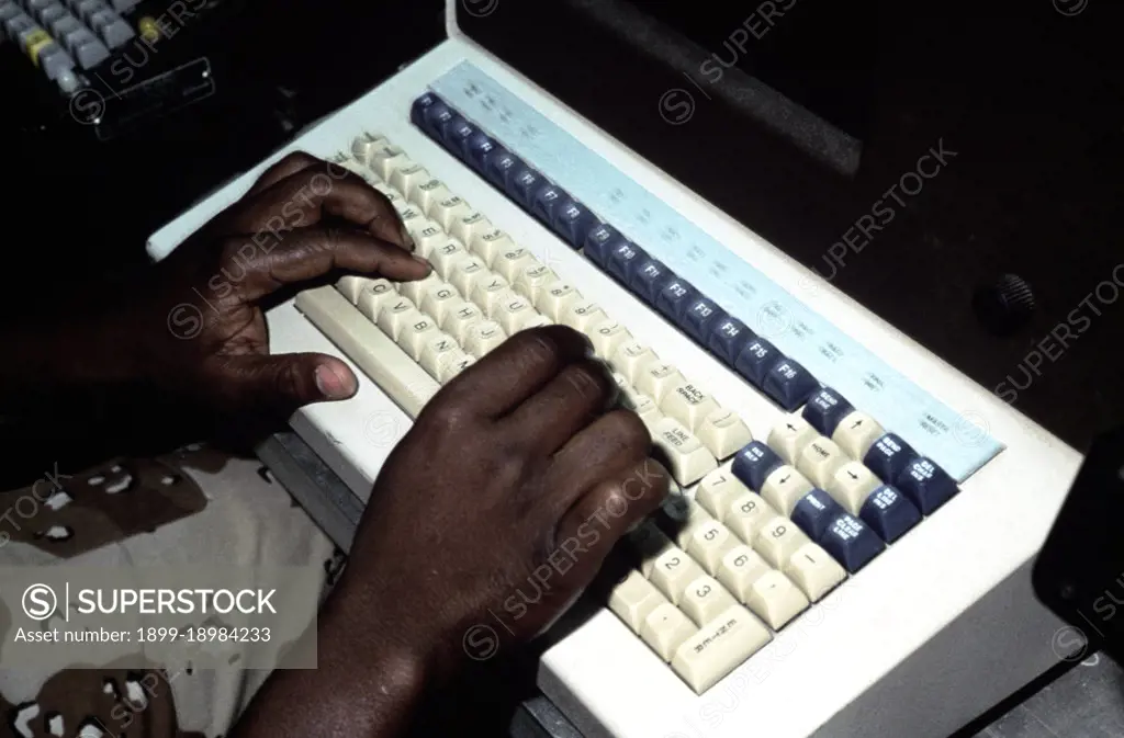 A radioman of the Joint Communications Support Element checks a computer terminal for the day's incoming messages.  He is participating in Exercise SHADOW HAWK '87, a joint Jordan/US Exercise within Exercise BRIGHT STAR '87.  SHADOW HAWK is a combined effort of the US Central Command and the Joint Chiefs of Staff.. 