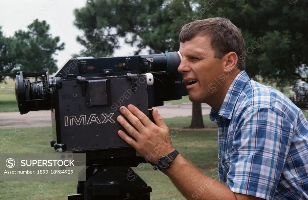 (20 July 1991) --- Astronaut Stephen S. Oswald, STS-42 pilot, uses the IMAX camera system (ICS) during training session held at Johnson Space Center's (JSC) Manned Space Flight Exhibit Complex Bldg 90 (Rocket Park). Oswald squints as he looks through the ICS eyepiece.. 