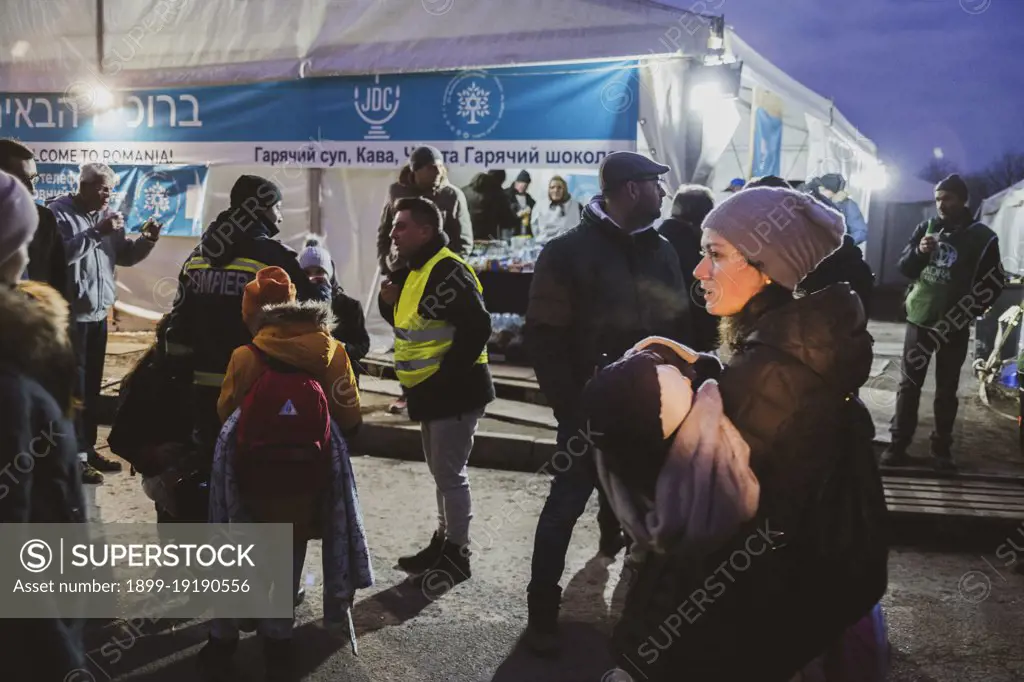 Ukranian refugees cross the border from Ukraine into Romania, at the border of Siret, in northern Romania, where they are welcomed by many different organizations which give them warm clothes, food and a place where to stay while they await for their transportation to their country of final destination