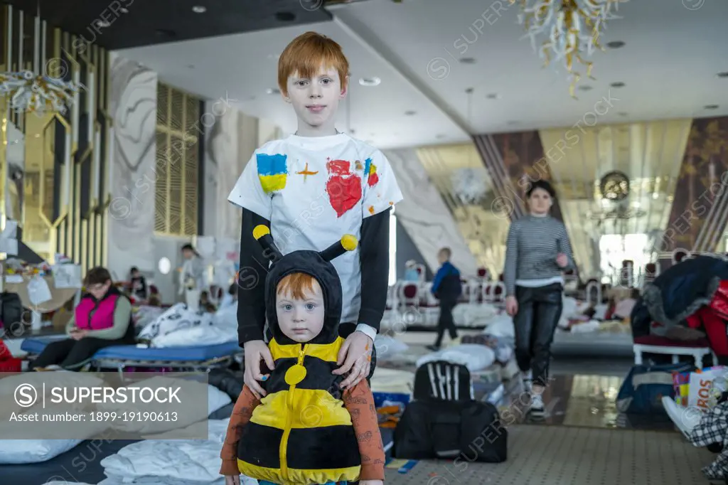 Ukranian refugees at a temporary shelter created inside the big ballroom and reception hall of the luxurious hotel Mandachi, in the Romanian town of Suceava, around 30 minutes from the border between Ukraine and Romania