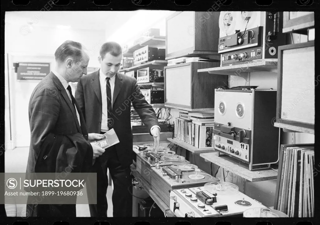 Salesman in a tape recorder showroom show potential customer various models and options, no location, 3/7/1964. (Photo by Warren K Leffler/US News & World Report Collection/GG Vintage Images/UIG)