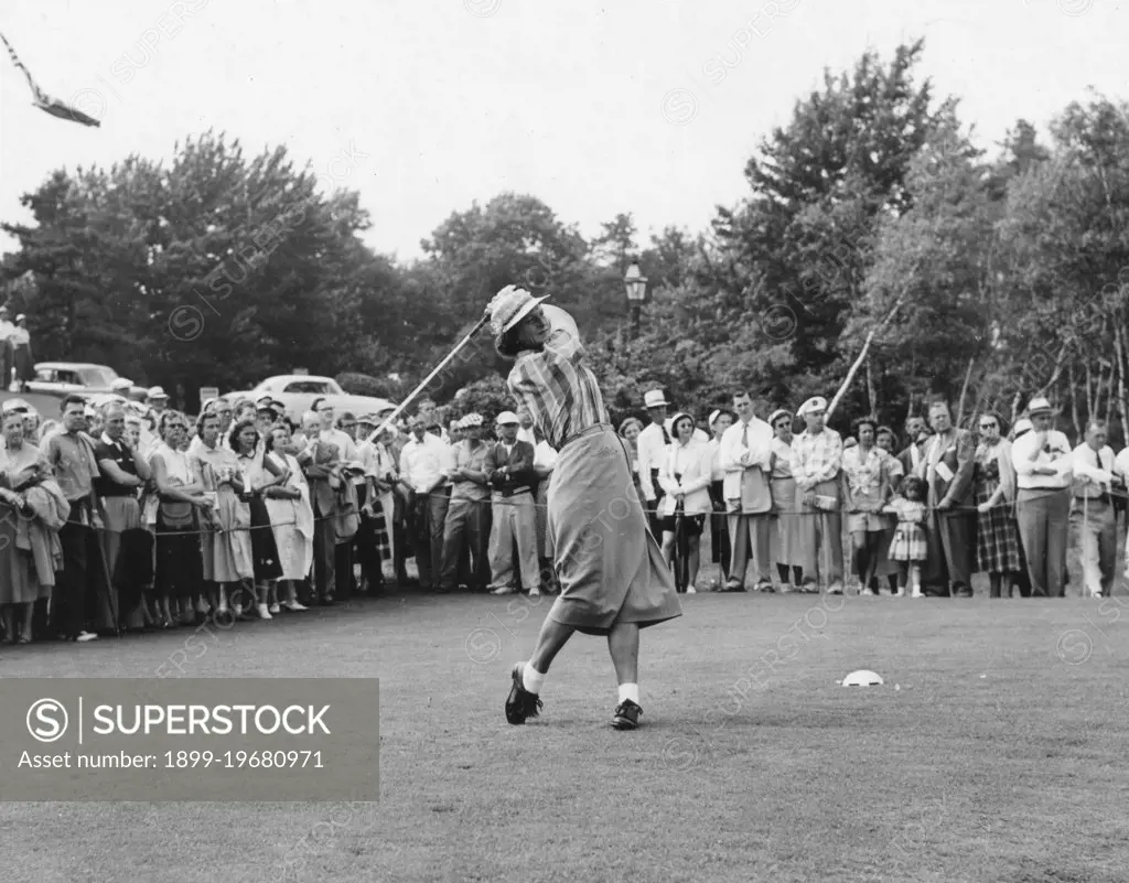 Babe Didrickson Zaharias drives the ball from the 10th tee in the first round of the Women's National Open Gold Championship. Peabody, MA, 7/1/54.