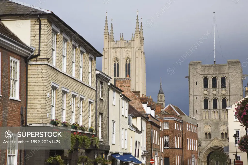 Tower of Saint Edmundsbury Cathedral above a street of historic buildings, Bury St Edmunds, Suffolk, England