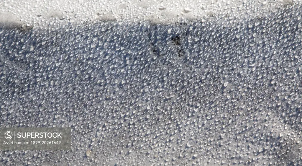 Water droplets dew condensation on fleece fabric in field