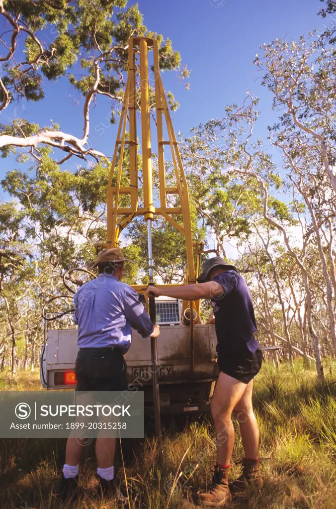 Soil testing: using core sampler which pressses cylindrical corer up to 2m into soil Australia