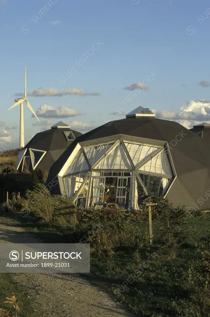 Domed ecohouses, Torup Eco village. Ecological Low Energy Housing, Denmark. The ecohouses have a turf roof and are partially buried to conserve heat. They reduce heat loss, by about 30% (even more in extreme conditions).