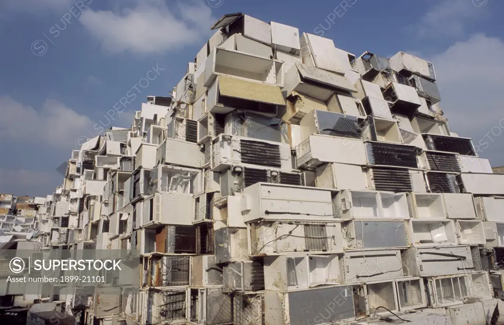Southerham Fridge mountain, Lewes, Sussex, United Kingdom. Southerham fridge mountain. 70,000 refridgerators awaiting recycling, stored in old chalk quarry near Lewes Sussex, in piles 20 high. They are 'chewed' up by a 2.5 million pound machine built by German SEG. The 'Fridge Eater' chews 15 per hour, the backs with the CFCs are removed before the rest is processed and placed in sacks. The sacks hold the remains of 100 recycled fridges.
