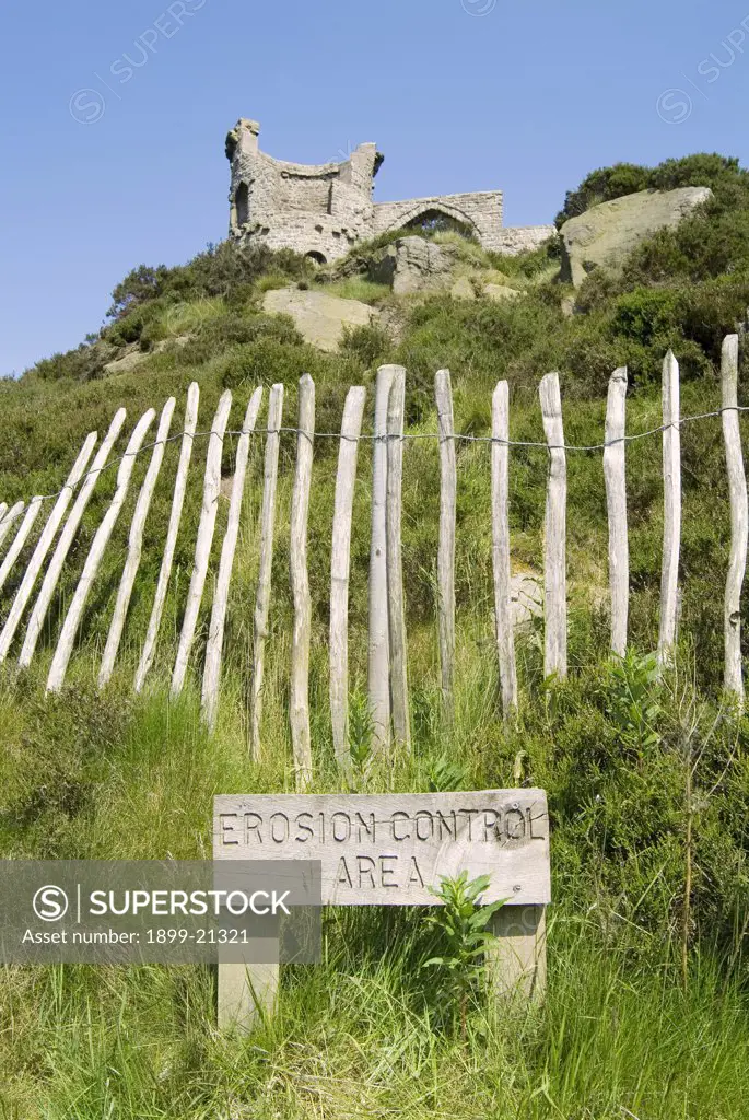 Erosion control around a tourist attraction, United Kingdom. Erosion Control Area' - Area fenced off to protect tourist attraction, Victorian Folly on Mow Cop which straddles Cheshire / Staffordshire border.