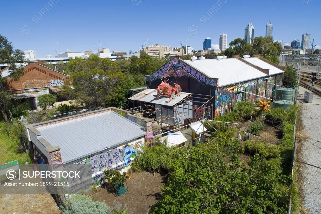 General view of Perth City farm - next to railway line, high-rise city skyline in back ground, Perth, Western Australia . 