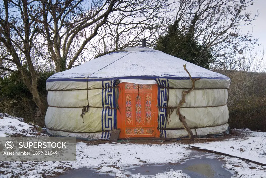 Traditional decorated yurt, United Kingdom. Traditional decorated mongolian, central Asian type yurt in welsh valley in snow - Gower, South Wales, UK.