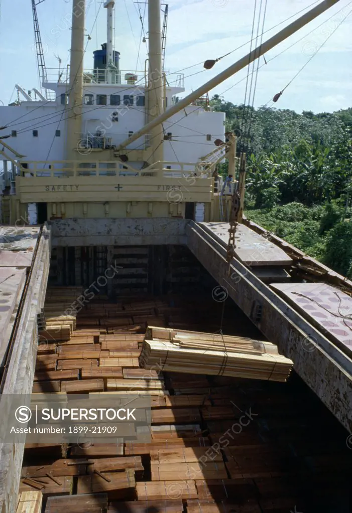 BRAZIL Amazon Logging. Timber being loaded onto ship for export..  