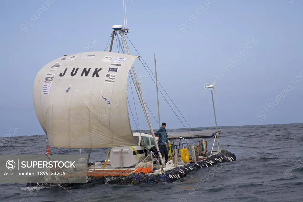 Raft named 'Junk'. On the third day of the trip the 'Junk' sets sail about 65 miles from shore. Pictured is Joel Paschal. On Sunday June 1, the raft named 'Junk' left Long Beach for its 2100 mile voyage to Hawaii to bring attention to the plastic marine debris (nicknamed the plastic soup) accumulating in the North Pacific Gyre. . 