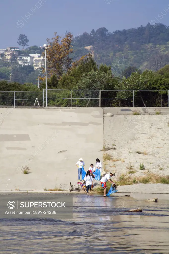 Cleaning up the Glendale narrows. FoLAR' (Friends of the LA River) annual river cleanup. Thousands of volunteers at 14 sites pulled out accumlated trash, mostly plastic bags, from river runoff that might normally find it's way downstream into the Pacific Ocean. 