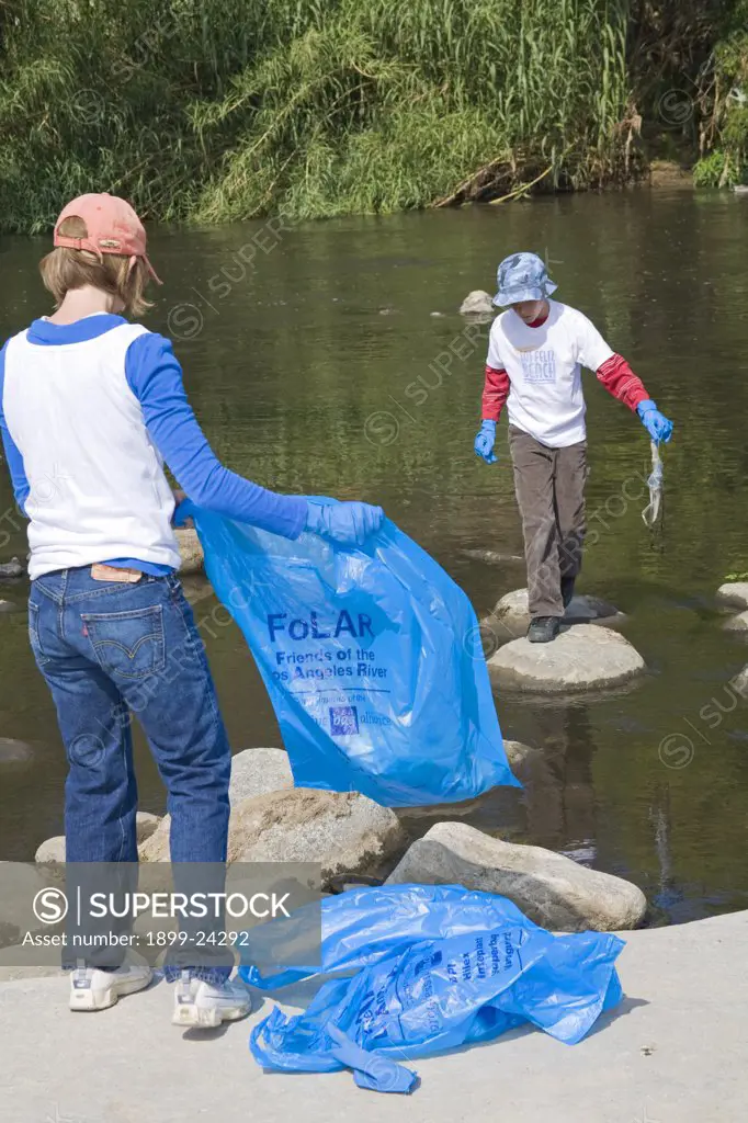 Cleaning up the Glendale narrows. FoLAR' (Friends of the LA River) annual river cleanup. Thousands of volunteers at 14 sites pulled out accumlated trash, mostly plastic bags, from river runoff that might normally find it's way downstream into the Pacific Ocean. 
