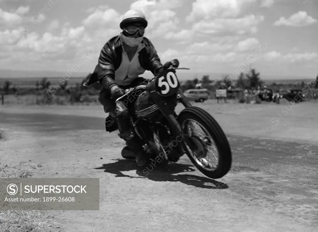 Number 50 in mid-race. Good is captured mid-race as he rides motorcycle number 50 in an event at the Langa Langa racing circuit. Langa Langa, Kenya, 13 October 1957. Langa Langa, Rift Valley, Kenya, Eastern Africa, Africa.