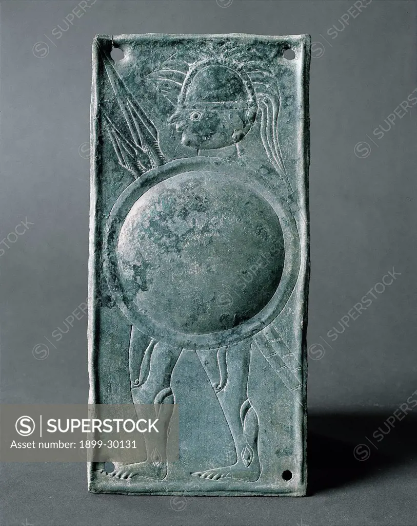 Warrior with round shield - Caldevigo, by Unknown, 5th Century, bronze. Italy, Veneto, Este, National Museum. Whole artwork. Lamina votive bronze warrior soldier lance: spear shield helmet cuirass jamb embossing.