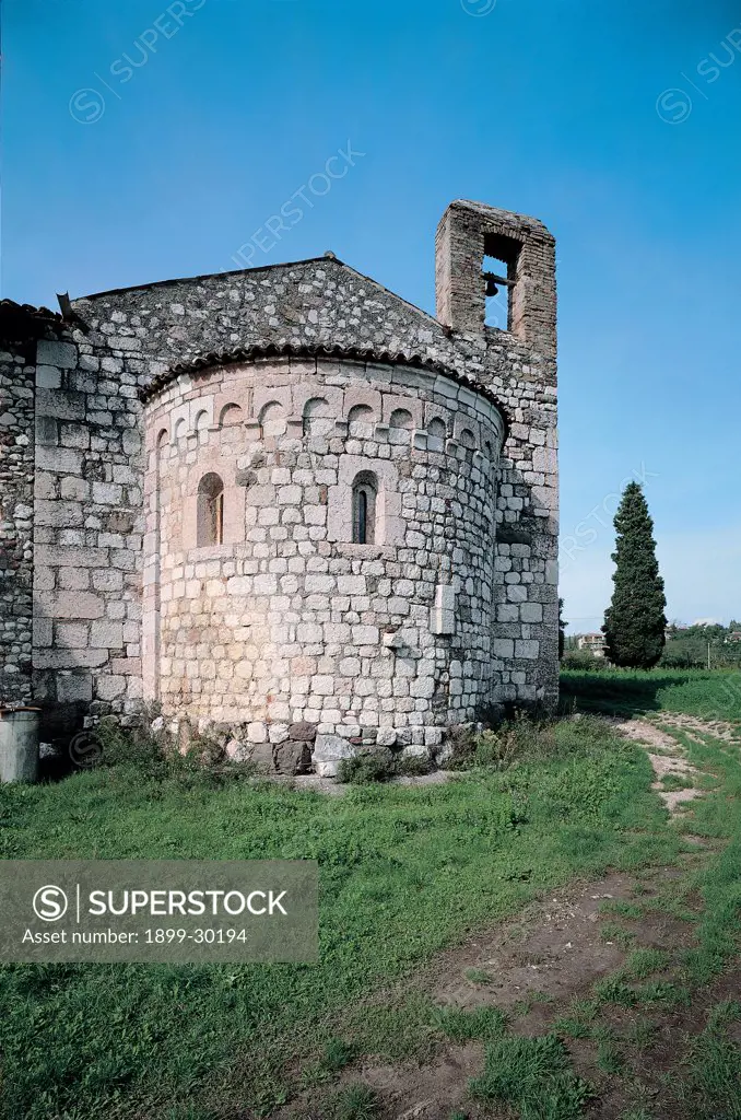 Sant'Emiliano church, by Unknown, 12th Century, Unknow. Italy, Lombardy, Padenghe sul Garda, Brescia. Sant'Emiliano church parish church apse exterior stone walls bell tower tree windows arcading.