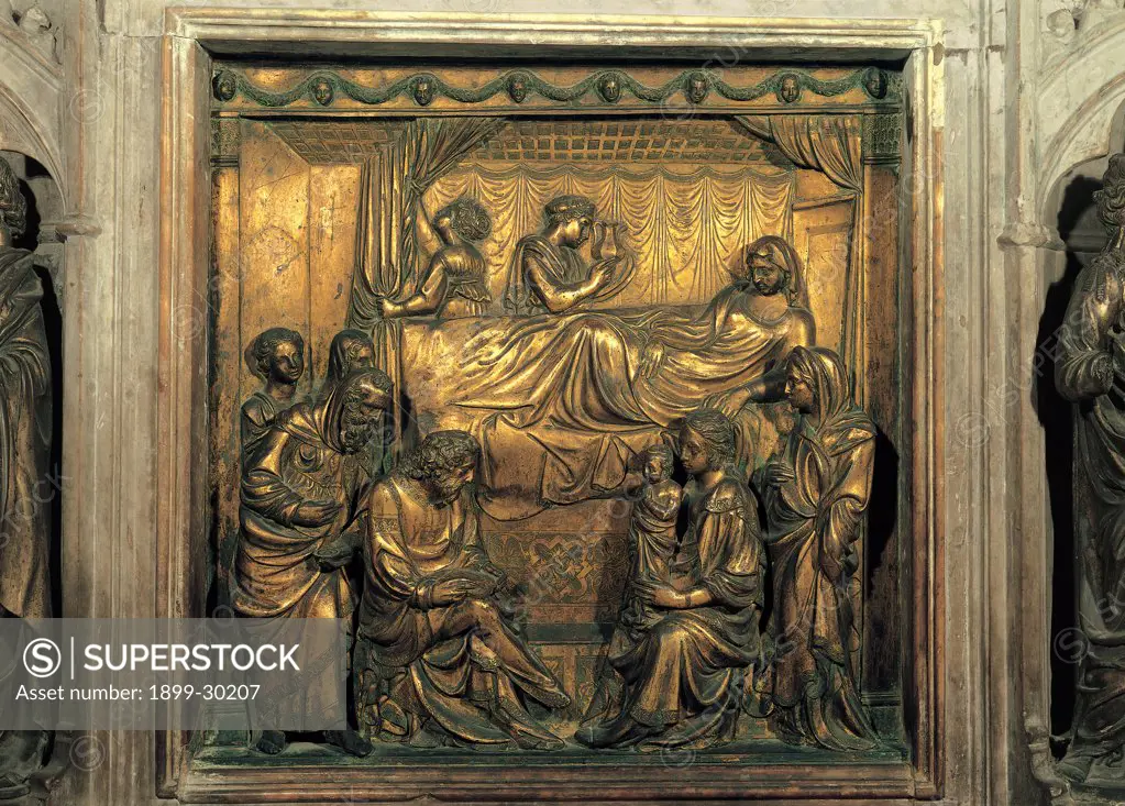 Gilded Brass Panel Decorated with the Birth of John the Baptist, by Turino di Sano, Giovanni Turino, 1417 - 1427, 15th Century, brass, lost-wax casting, golding. Italy, Tuscany, Siena, San Giovanni Parish Church. Detail. Panel gilded brass Birth John the Baptist woman in labor lying St Elisabeth Zachariah feet bed canopy curtains ceiling woman holding a child.