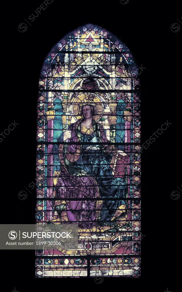 Window with saint enthroned, by Unknown, 15th Century, stained-glass window. Italy, Tuscany, Florence, Santa Maria del Fiore Basilica, window above side-aisle. Detail. Top window rounded arch ogival arch female saint halo aureole crown seated on throne holding half-closed book in left hand and a stick in her right hand late Gothic no perspective or depth flat except predella.