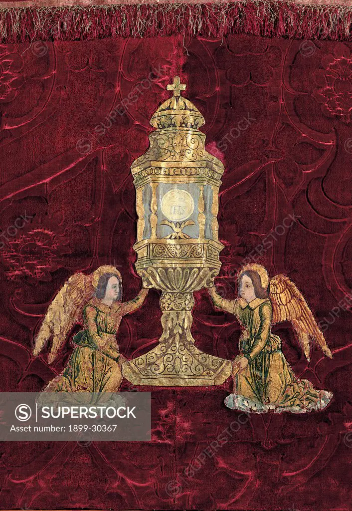 Altar-cloth with monstrance held up by angels, by Unknown, 17th Century, Unknow. Italy, Lombardy, Gandino, Bergamo, Santa Maria Assunta Basilica, Museum. Detail. Tapestry red velvet pique monstrance angels Host: particle Bernardine monogram.