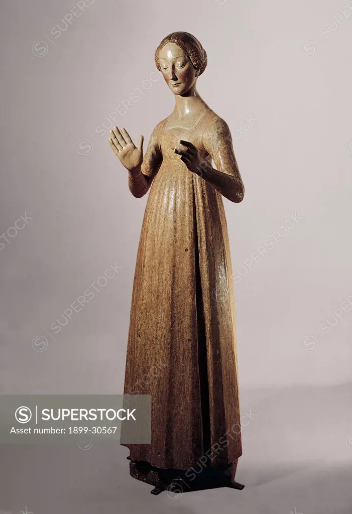 Madonna Annunciate, by Civitali Matteo, 15th Century, freestanding and painted wood. Italy, Tuscany, Modugno, Lucca, Santissima Maria Annunziata Parish church. Whole artwork. Mary Madonna Virgin Annunciation female figure standing tied hair open arms Renaissance sculture.