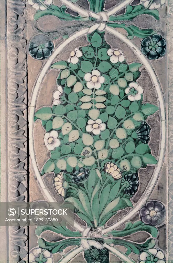 Tomb of Bishop Benozzo Federighi, by Della Robbia Luca, 1455, 15th Century, majolica. Italy, Tuscany, Florence, Santa Trinita Church. Detail decorative frieze ribbons bouquets flowers leaves.