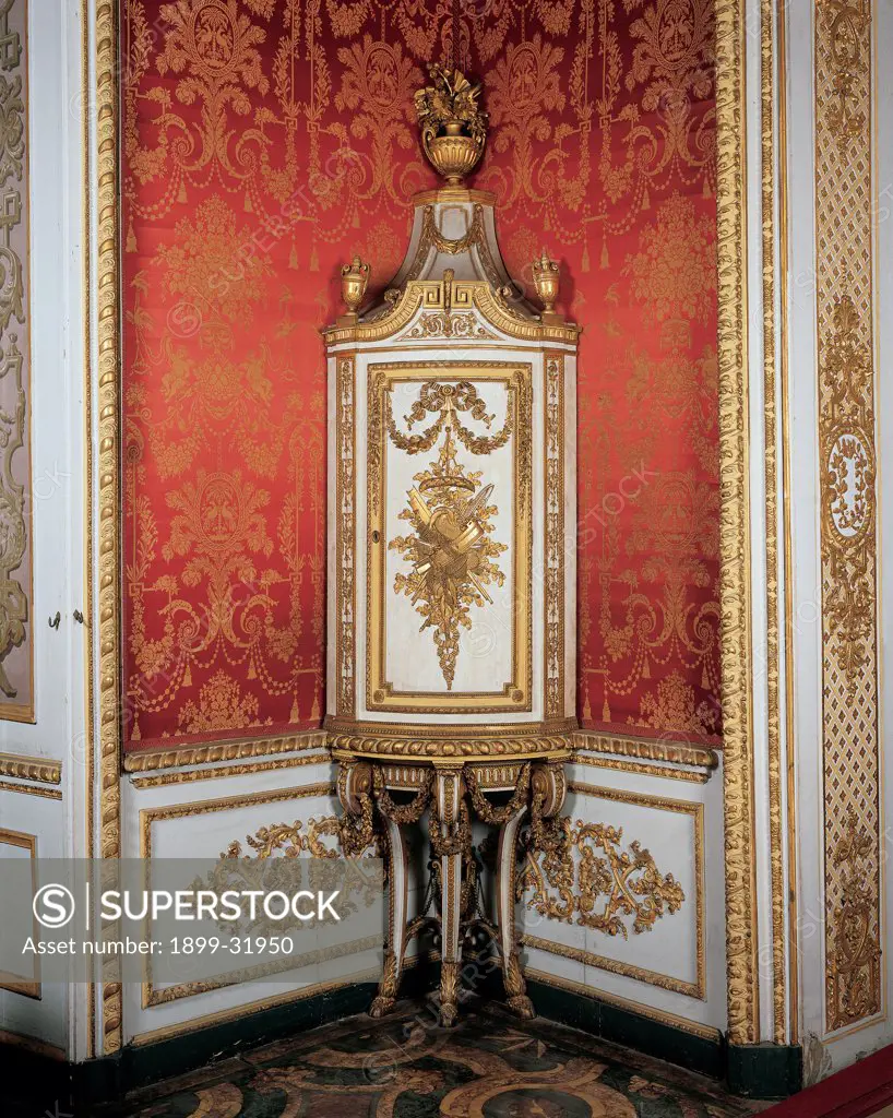 Corner cabinet, by Bolgie Francesco, 1789, 18th Century, wood carved, gilded and painted. Italy, Piemonte, Turin, Royal Palace. View corner cabinet white gold garlands phytomorphic motifs tapestry: wallpaper.