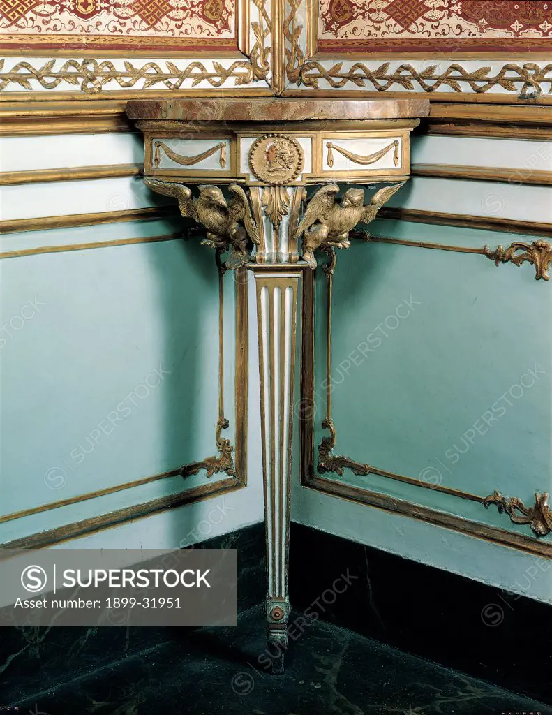 Corner console, by Naples workmanship, 18th Century, painted wood and gilded. Italy, Campania, Caserta, Royal Palace. Whole artwork. Corner console decoration decorative motifs shelf furniture furnishings fittings design.
