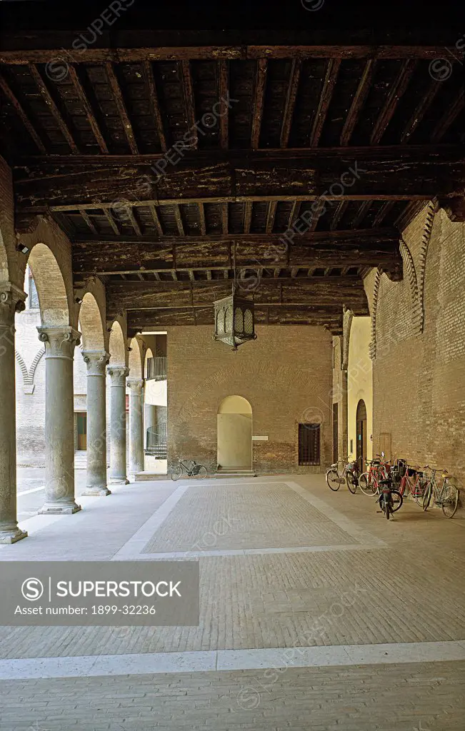 Ferrara, Estense Castle of San Michele, courtyard, by Unknown, 1358, 14th Century, Unknow. Italy, Emilia Romagna, Ferrara, Estense Castle, San Michele Castle. Loggia portico: porch colonnade ceiling wooden beams lamp.