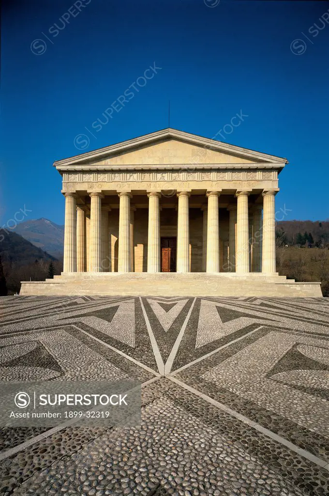 The Temple in Possagno, by Canova Antonio, 1819, 19th Century, marble. Italy, Veneto, Possagno, Treviso, Canova's Temple. Front view of pronaos with Doric colonnade with architrave triangular pediment parvis of river pebbles.