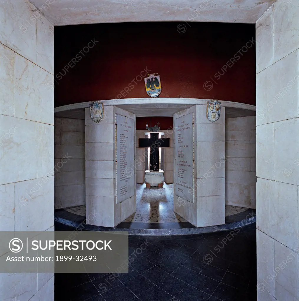Mausoleum, interior, by Unknown, 20th Century, Unknow. Italy, Lombardy, Gardone Riviera, Brescia, The Vittoriale. View Mausoleum interior pillars with rectangular base cross war victims stele with inscription ambulatory.
