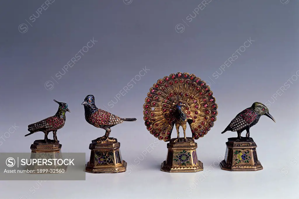 Eastern birds, by Unknown, 19th Century, brass and semiprecious stones. Italy, Lombardy, Gardone Riviera, Brescia, The Vittoriale. Whole artwork. Knick-knacks objects collection birds winged creatures colors.