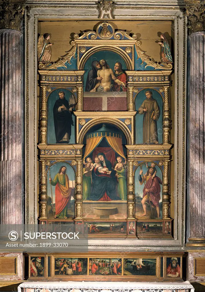 Polyptych with Madonna and Child Enthroned, by attributed De Ferrari Bernardino, 16th Century, panel. Italy, Lombardy, Vigevano, Pavia, Cathedral. Whole artwork. Polyptych Virgin Mary Madonna throne Infant Jesus: Christ Child: Baby Jesus: Child Jesus Saints Biblical scenes: episodes: stories Pieta.