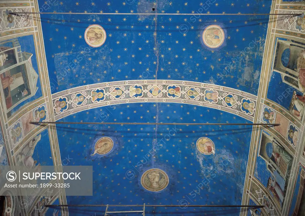 Fresco cycle in the Scrovegni Chapel, by Giotto, 1304 - 1306, 14th Century, fresco. Italy, Veneto, Padua, Scrovegni Chapel. Detail. Vault starry sky blue gold tondos frame: cornice saints prophets panels.