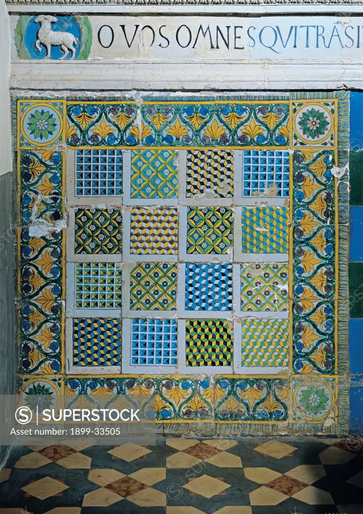 Tiles of the Stigmata Chapel, by school Della Robbia, 15th Century, glazed polychrome terracotta. Italy, Tuscany, Arezzo, La Verna Sanctuary, Stigmata Chapel. Detail. Tiles floral motifs geometries yellow blue green.