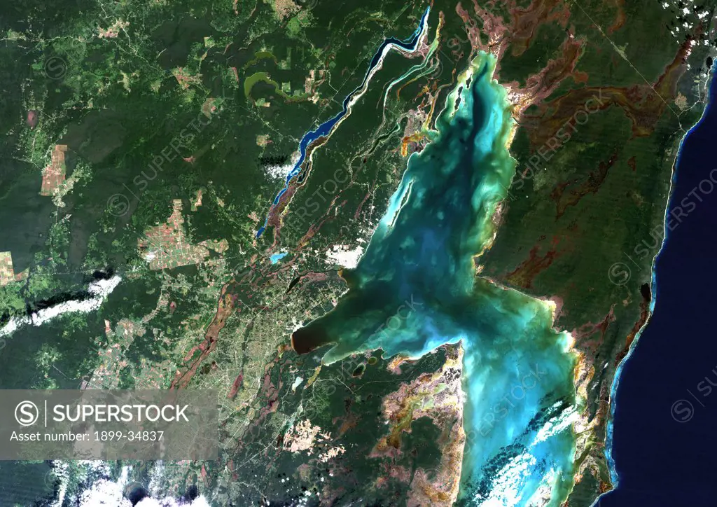 Chetumal Bay, Mexico, True Colour Satellite Image. True colour satellite image of the Yucatan peninsula and Chetumal Bay, known for its coral reef, lies on the border between Mexico and Belize. Image taken on 20 November 1990 using LANDSAT data.