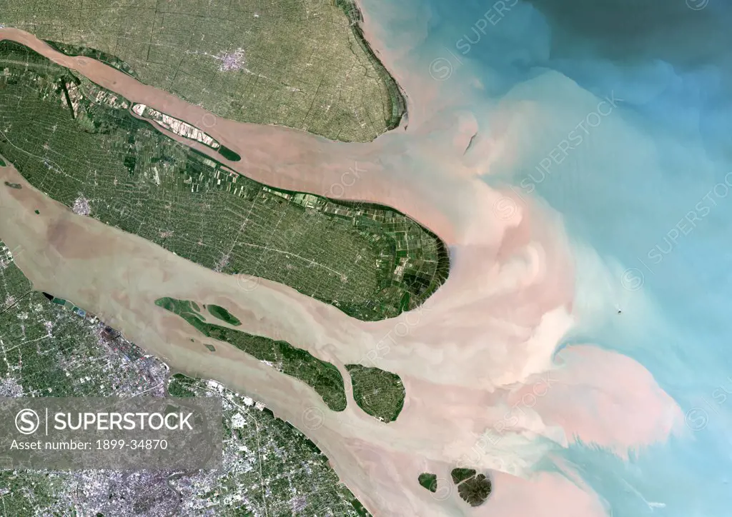Yangtze River, Shanghai, China, True Colour Satellite Image. Satellite image of the river mouth of the Yangtze river, the longest river in Asia, that flows into the East China Sea. The pink coloured water is highly polluted, sometimes even with toxic waste discharged into the river by factories of the city of Shanghai. The Yangtze river mixes then with the turquoise sea water. Image taken on 3 July 2001 using LANDSAT data.