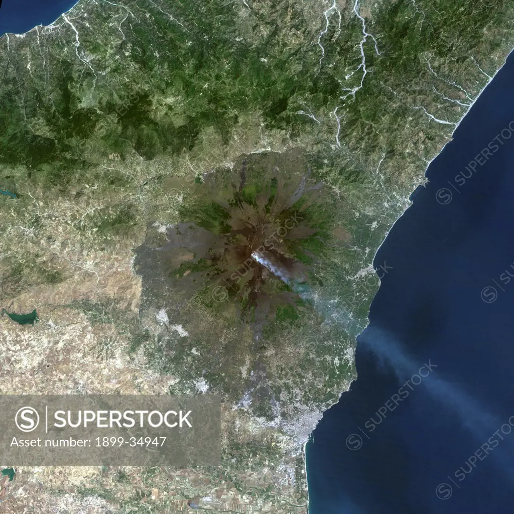 Mount Etna'S Smoke Plume In 1987, Italy, True Colour Satellite Image. Mount Etna, Sicily, Italy, true colour satellite image. Mount Etna is the highest active volcano in Europe, situated North-East of Sicily, 3350m high. The plume, kilometres high, contains smoke and ash. Image taken on 13 June 1987 using LANDSAT data. Print size 30 x 30 cm.