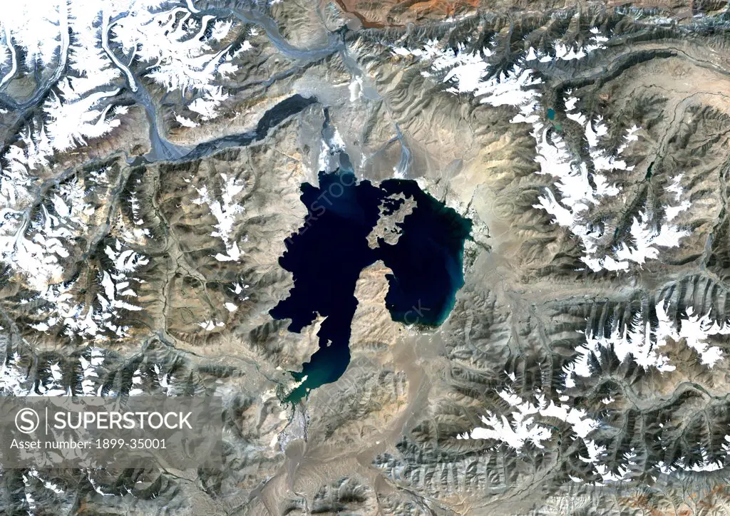 Kara-Kul Meteor Impact Crater, Tajikistan, True Colour Satellite Image. True colour satellite image of Kara-Kul impact structure, Tajikistan (age : 25 million years ; diameter : 52 km). Image taken on 27 September 1992 using LANDSAT data.