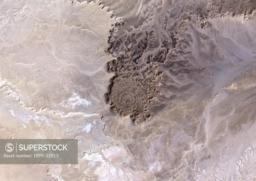 Tin Bider Meteor Impact Crater, Algeria, True Colour Satellite Image. True colour satellite image of Tin Bider impact structure, Algeria (age : 70 million years ; diameter : 6 km). Image taken on 19 February 1988 using LANDSAT data.