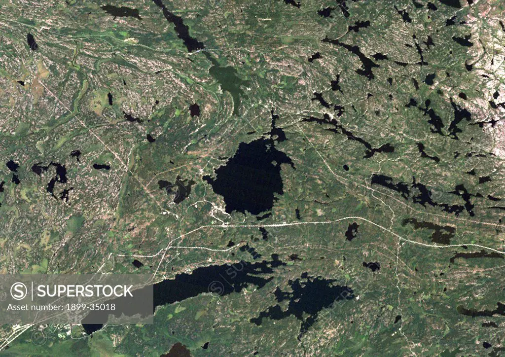 West Hawk Lake Meteor Impact Crater, Manitoba, Canada, True Colour Satellite Image. True colour satellite image of West Hawk Lake impact structure, Manitoba, Canada (diameter : 3,15 km). Image taken on 30 August 1990 using LANDSAT data.