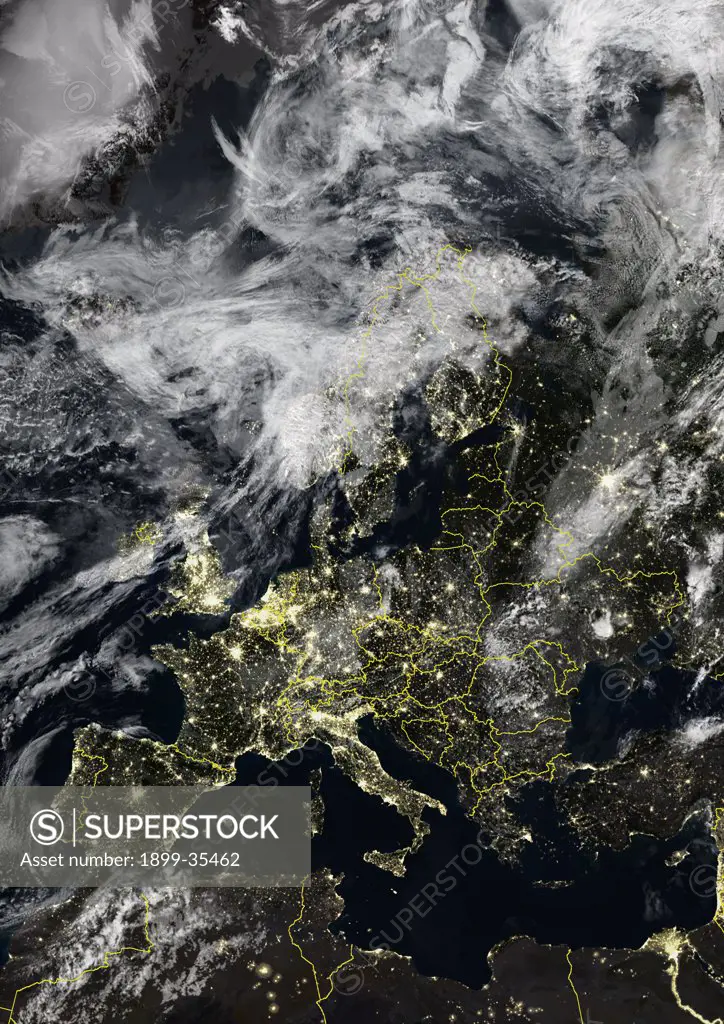 Europe At Night With Country Borders And Cloud Coverage, True Colour Satellite Image. True colour satellite image of Europe at night with country borders and cloud coverage. This image in Lambert Conformal Conic projection was compiled from data acquired by LANDSAT 5 & 7 satellites.